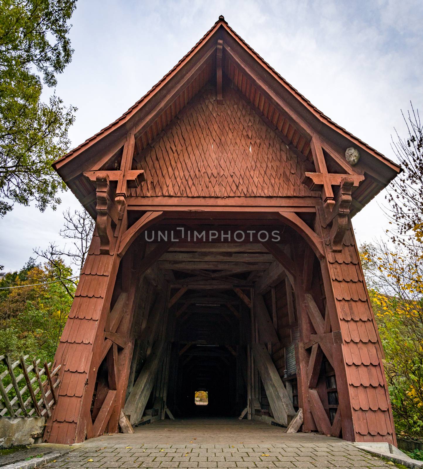 Historic wooden bridge at the hiking trail near the Beuron monastery in the Danube valley by mindscapephotos