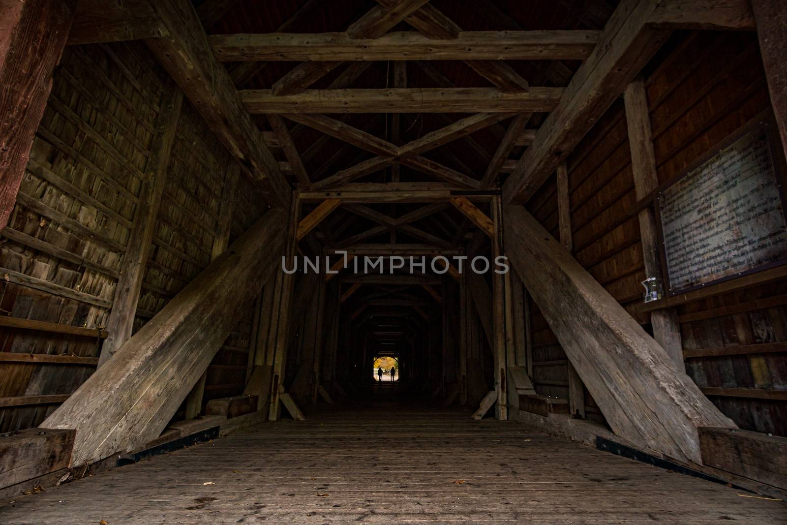 Historic wooden bridge at the hiking trail near the Beuron monastery in the Danube valley by mindscapephotos