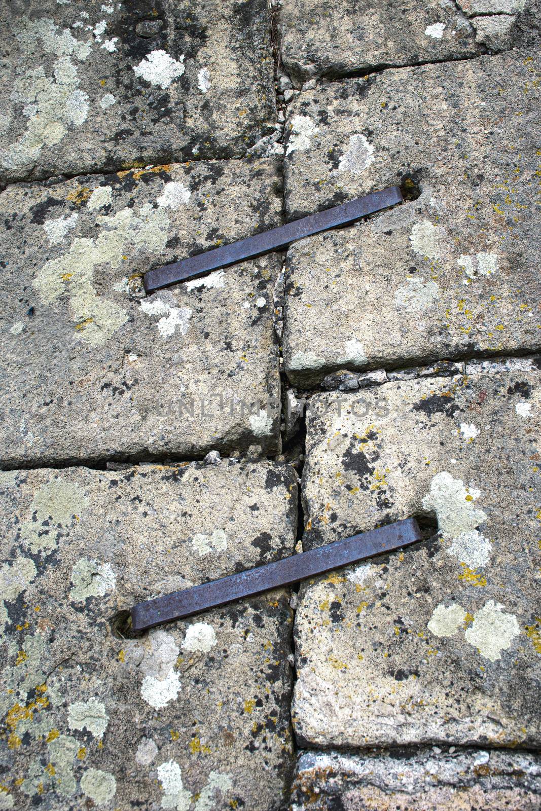 background iron clips on the joint of stone blocks