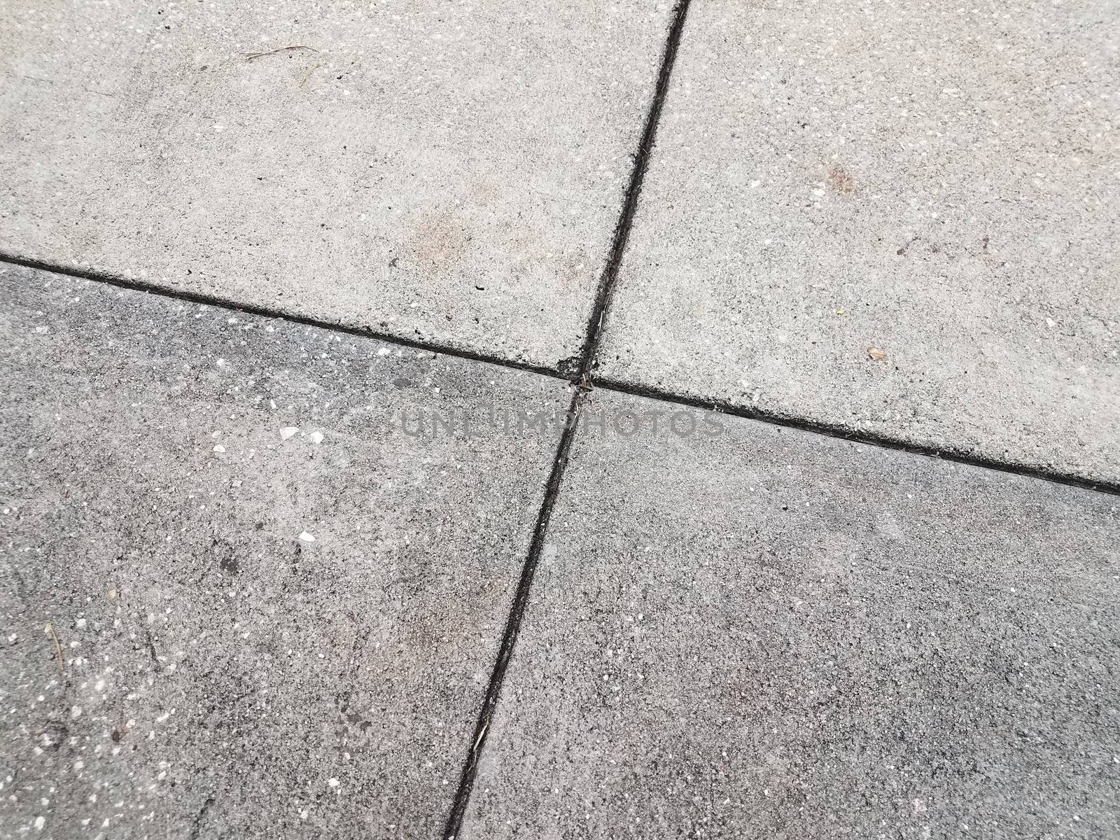 grey cement or sidewalk pavement tiles with lines