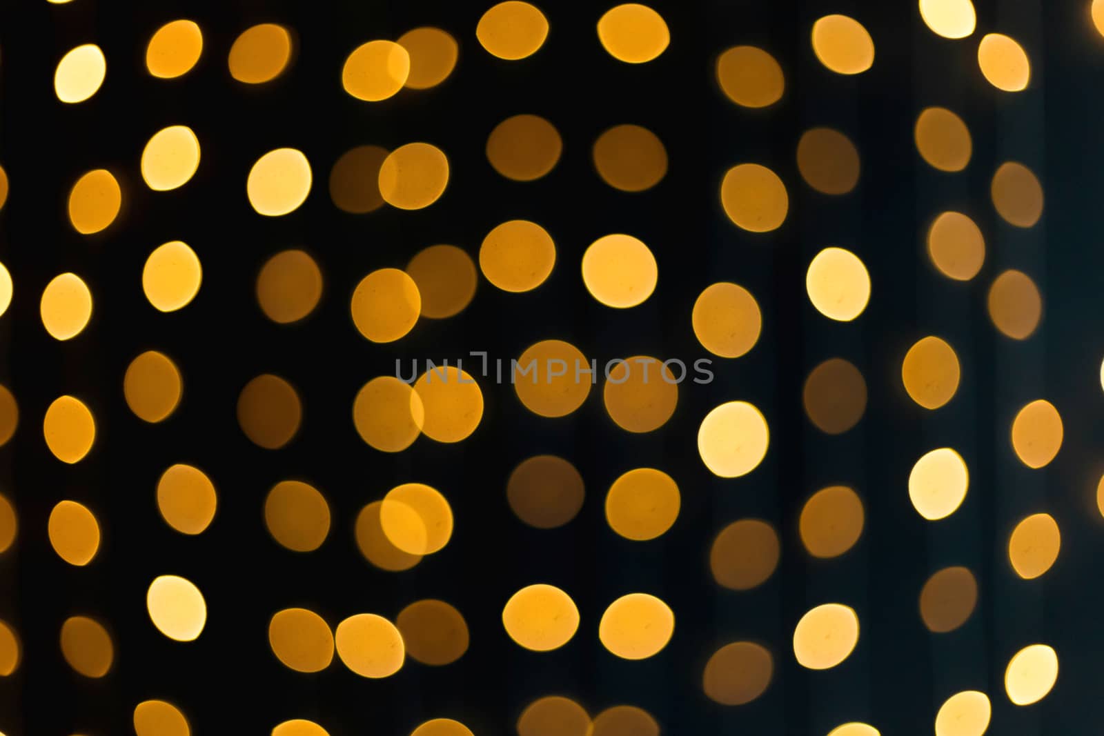 .Christmas background from bokeh from Christmas garlands on a black background by galinasharapova