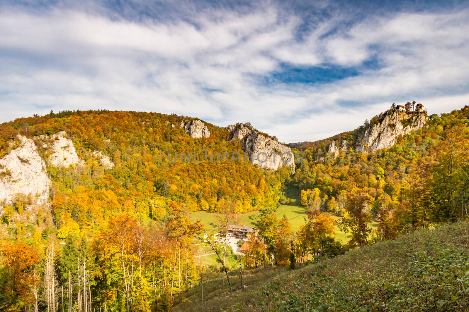 Colorful view of Bronnen Castle on the hiking trail in autumn in the Danube valley near Beuron by mindscapephotos