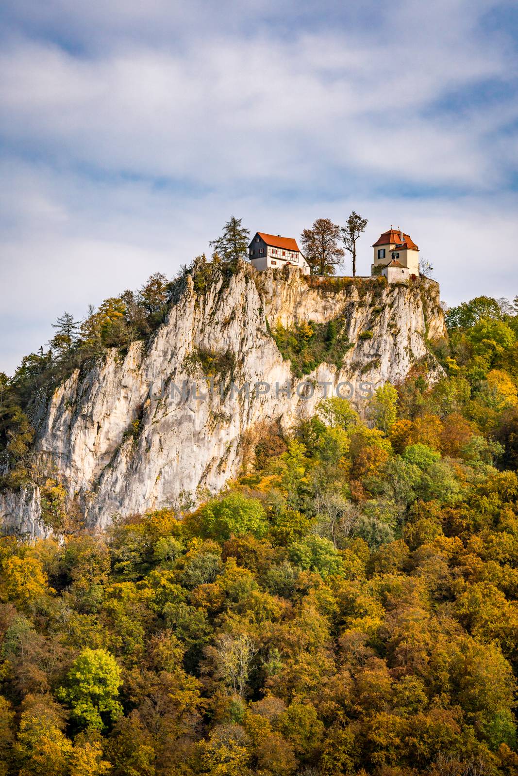 Colorful view of Bronnen Castle on the hiking trail in autumn in the Danube valley near Beuron by mindscapephotos