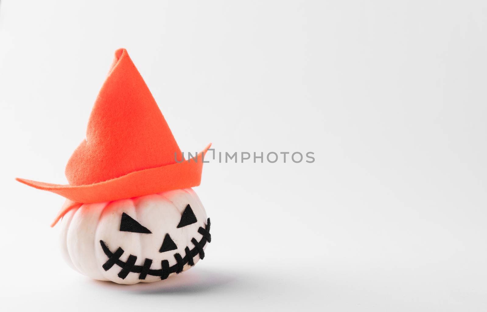 Funny Halloween day party concept ghost pumpkin head jack lantern scary smile wear hat, studio shot isolated on white background, Holiday decoration