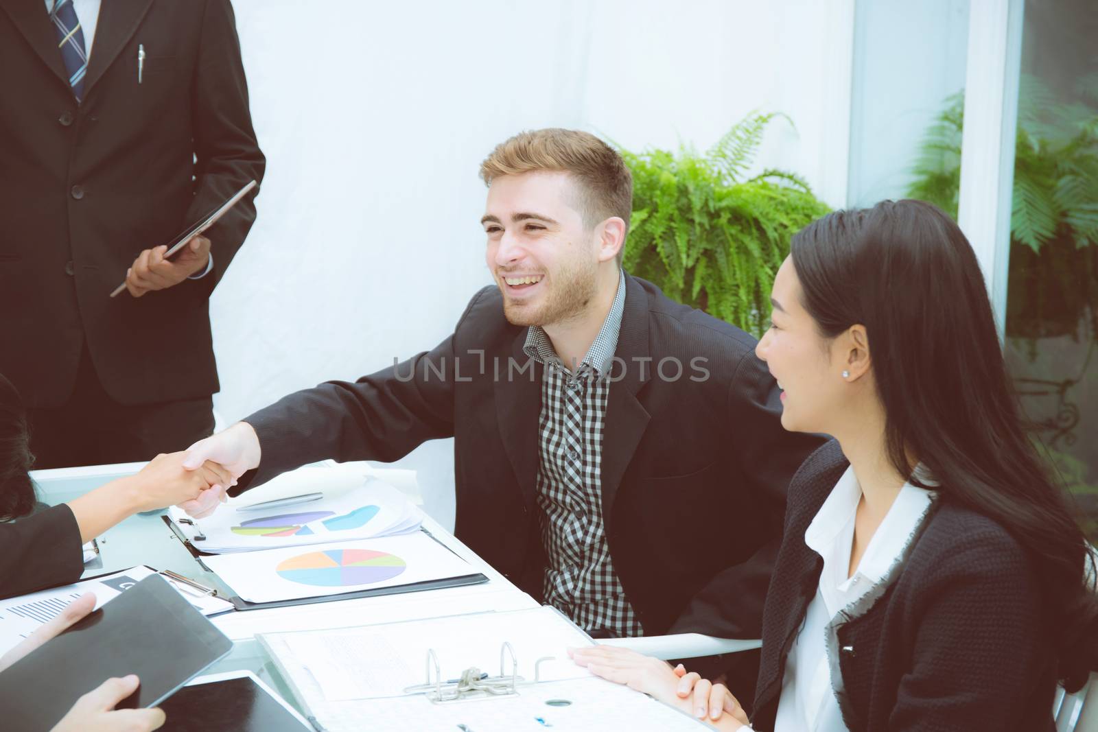 Group of business team people shaking hand with success, agreement of discussion with handshake after meeting  in teamwork, communication concept.