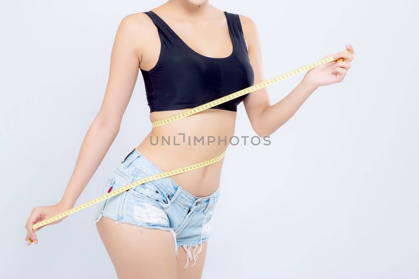 Asian woman diet and slim with measuring waist for weight isolated on white background, girl have cellulite and calories loss with tape measure, health and wellness concept.