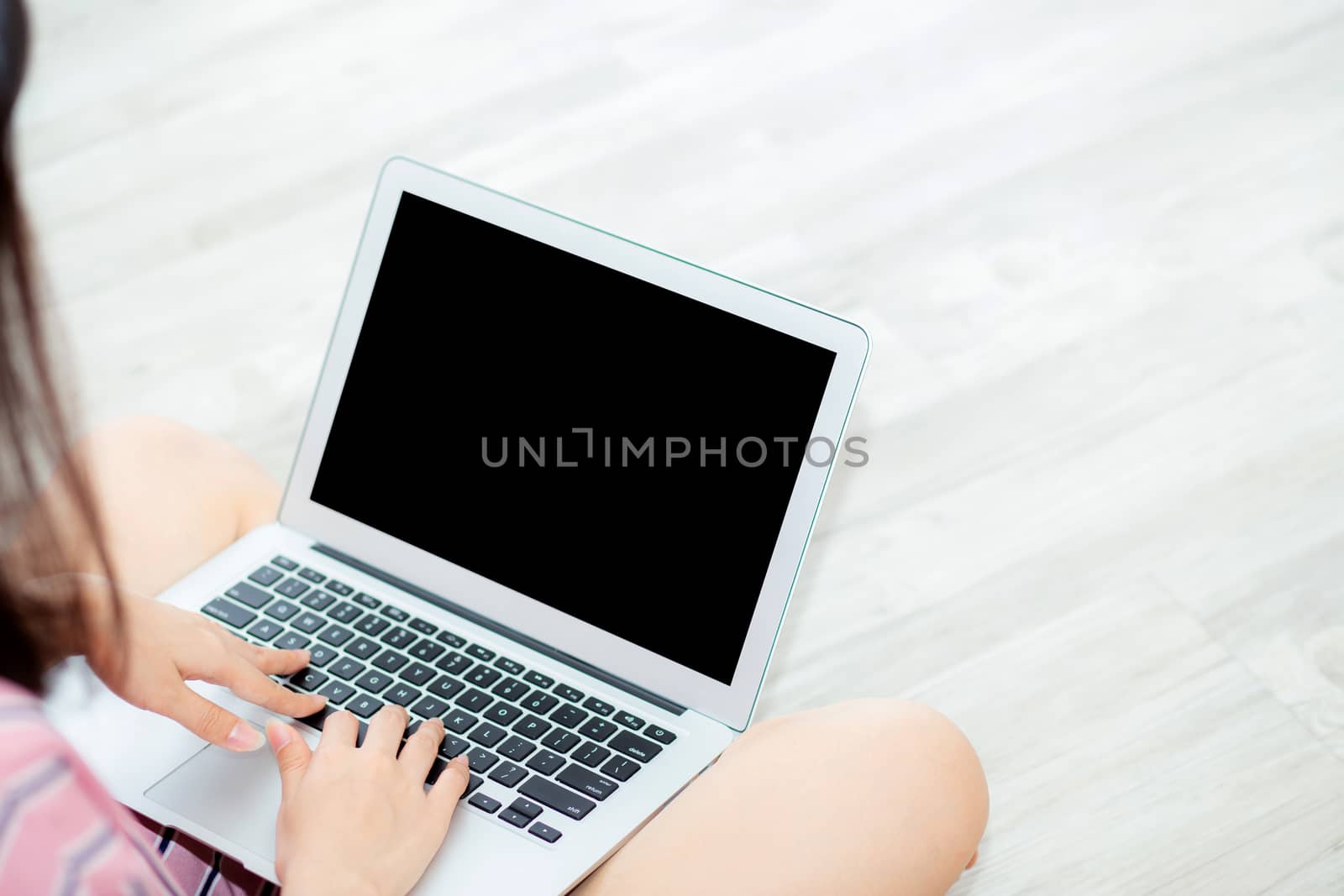 Portrait of beautiful asian young woman setting using laptop computer at on living room for leisure and relax, freelance with girl working notebook, communication and lifestyle concept.