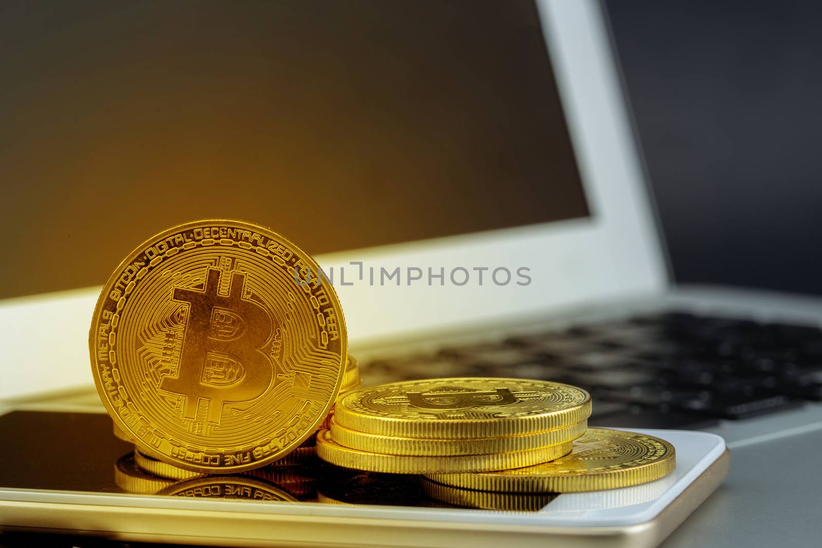 Bitcoin on smart mobile phone and laptop computer, gold coin with currency digital exchange cash with crypto, technology about money, commercial and finance concept.