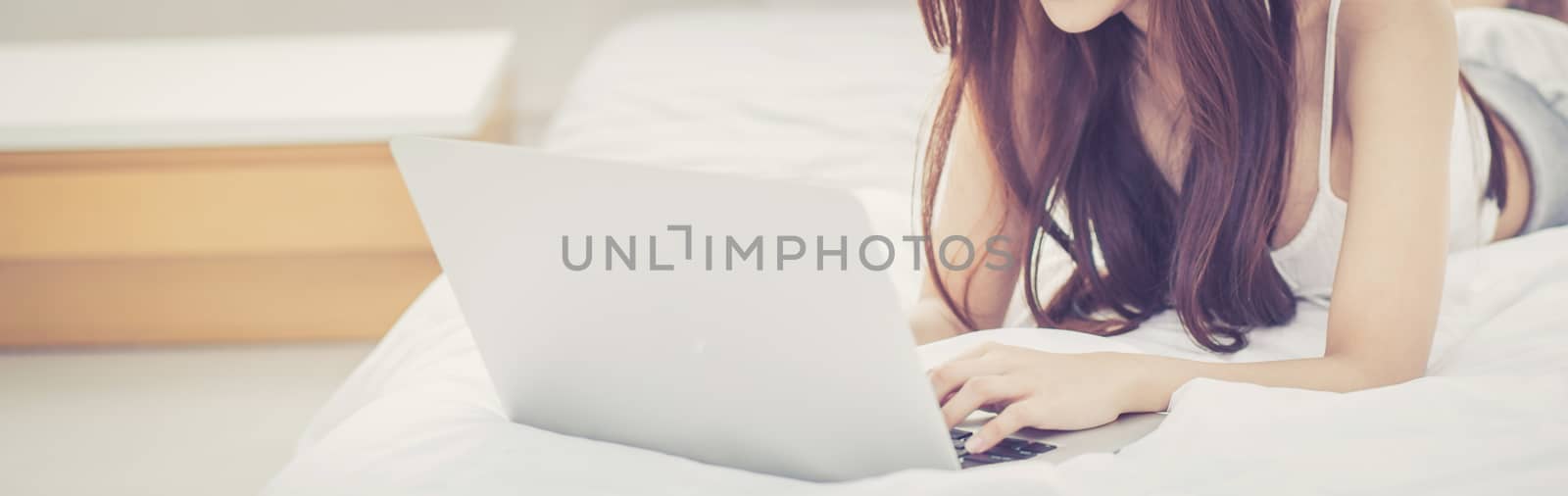 Banner website beautiful asian young woman relax listening to mu by nnudoo