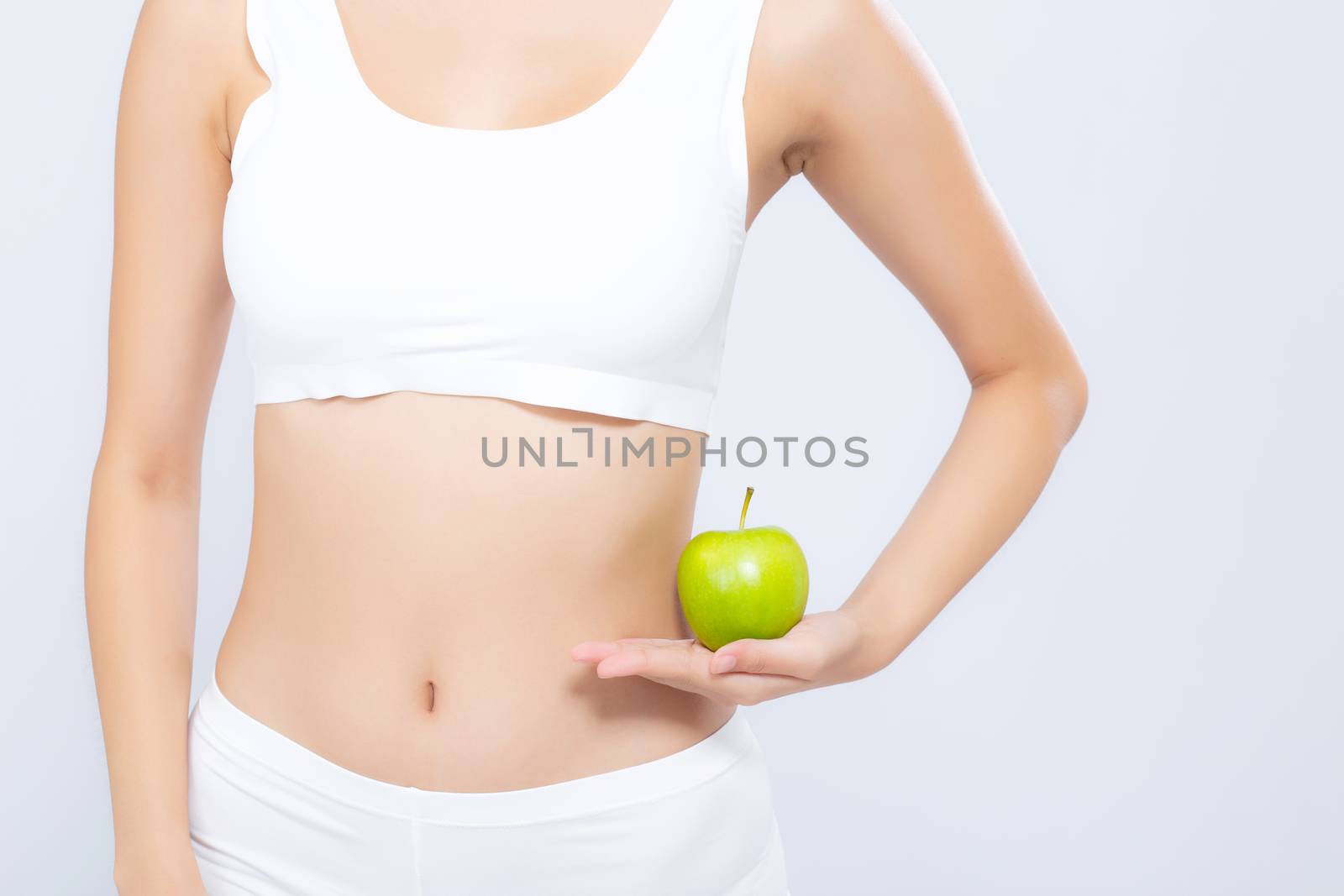 Beautiful body woman sexy slim holding green apple with cellulite for wellness, girl with fitness for weight loss and healthy isolated on white background, healthcare and diet concept.