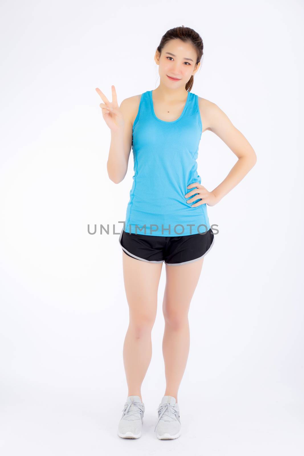 Full-length beautiful portrait young asian woman happy and smile in sport clothing with satisfied and confident isolated on white background, girl asia have shape and wellness, exercise for fit with health concept.