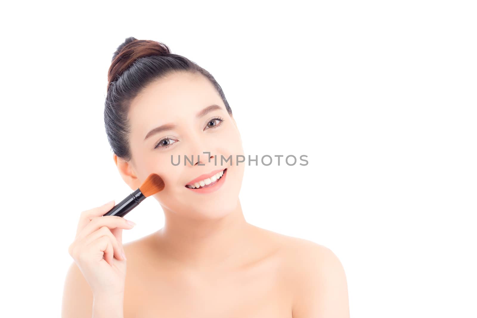 Beauty of portrait asian woman applying make up with brush of cheek isolated on white background, beautiful of girl holding blusher, skincare and cosmetic concept.