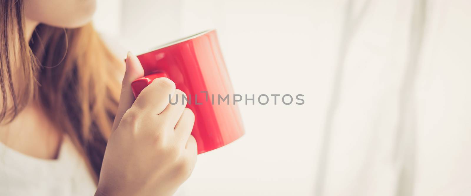 Banner website beautiful young asian woman with drink acup of co by nnudoo
