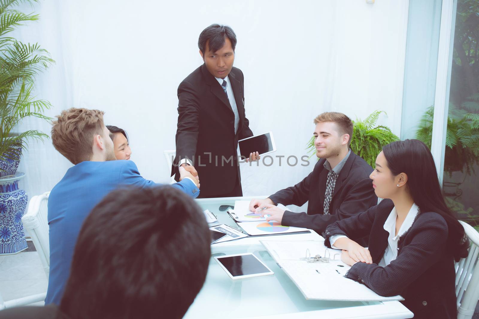 Group of business team people shaking hand with success, agreement of discussion with handshake after meeting  in teamwork, communication concept.