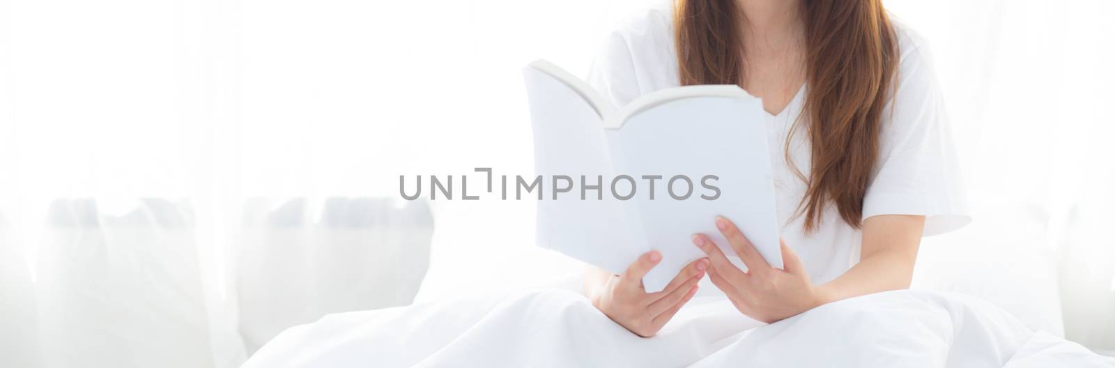 Banner website beautiful asian woman relax sitting reading book  by nnudoo