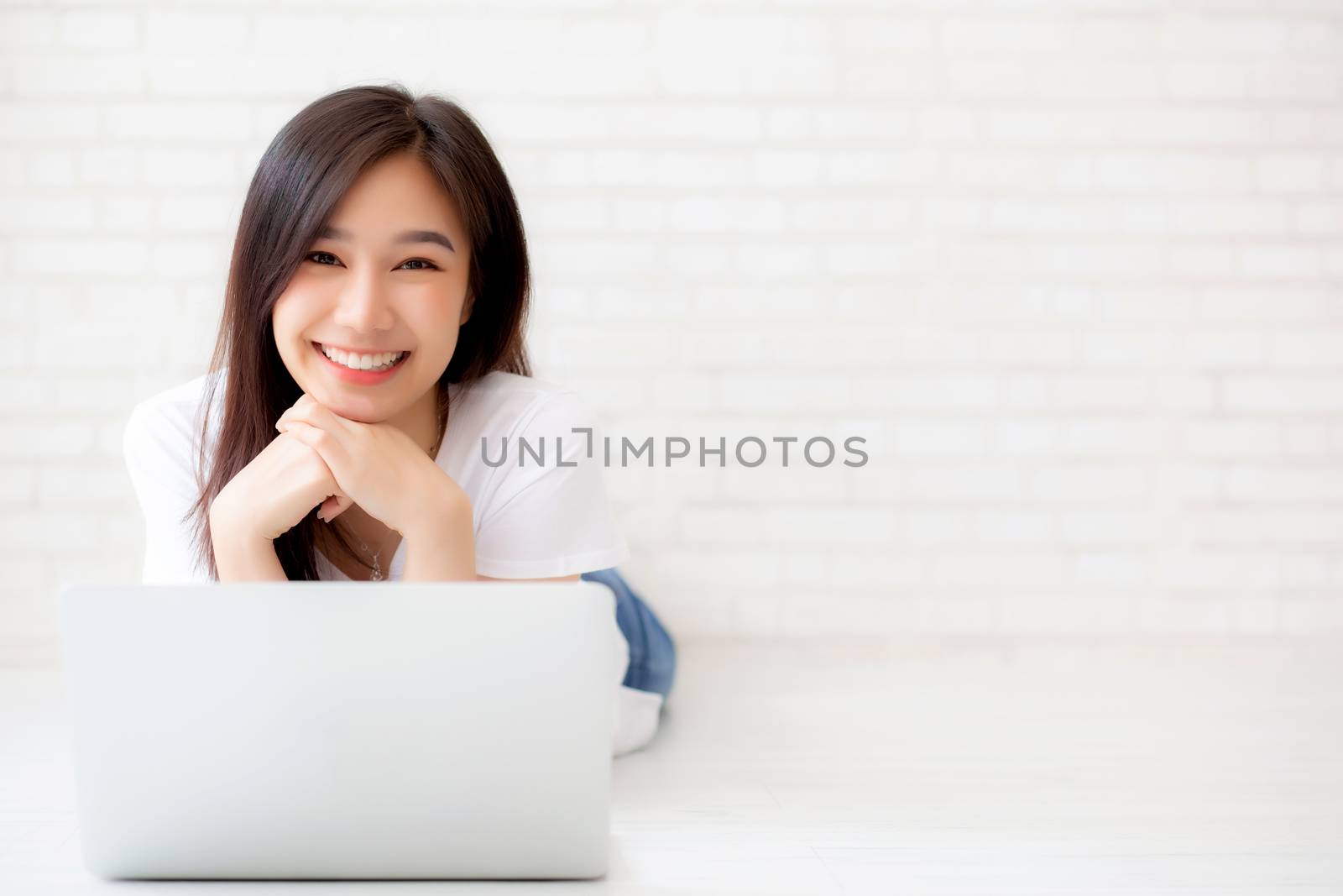 Beautiful of portrait asian young woman working online laptop ly by nnudoo