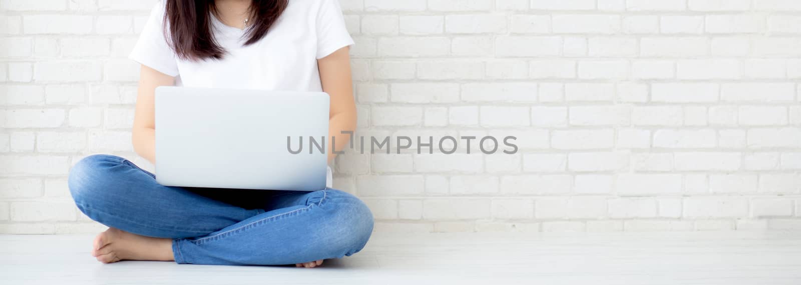 Banner website asian woman working online laptop sitting on floo by nnudoo