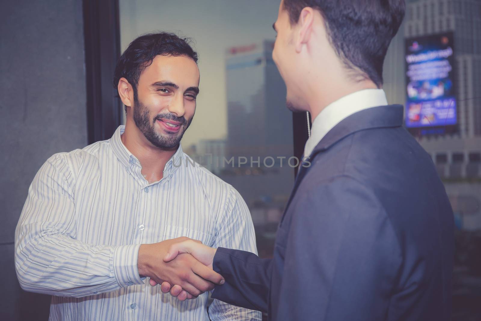 Two business man people shaking hand with success, agreement of discussion with handshake after meeting in teamwork, communication concept.