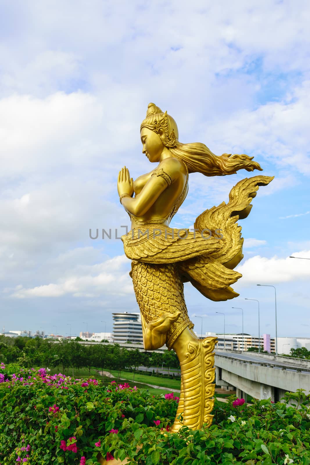 Kinnaree golden statue along the freeway.