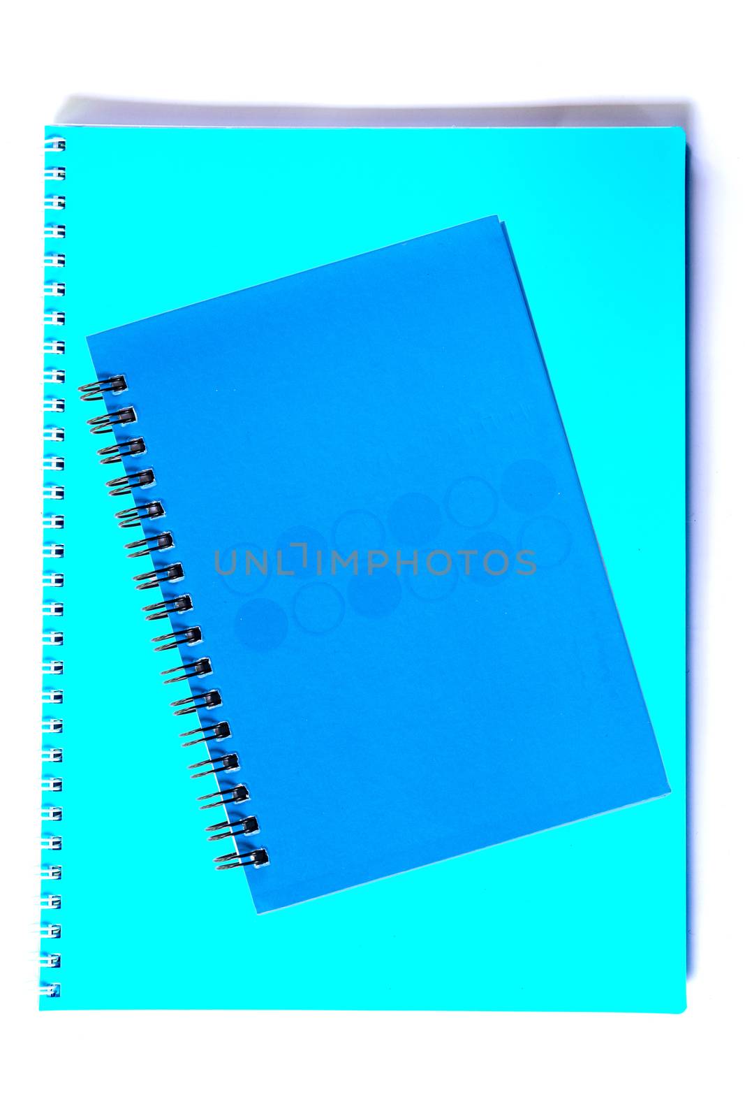 Colorful note book isolated on white background.