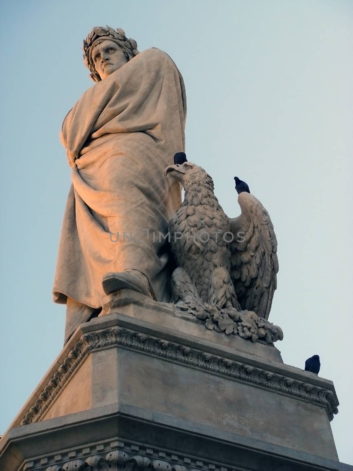 Monument to Dante Alighieri on Holy Cross Square (Piazza di Santa Croce) in Florence. Italy. The greatest Italian poet, author of the Divine Comedy, the work of sculptor Enrico Pazzi.