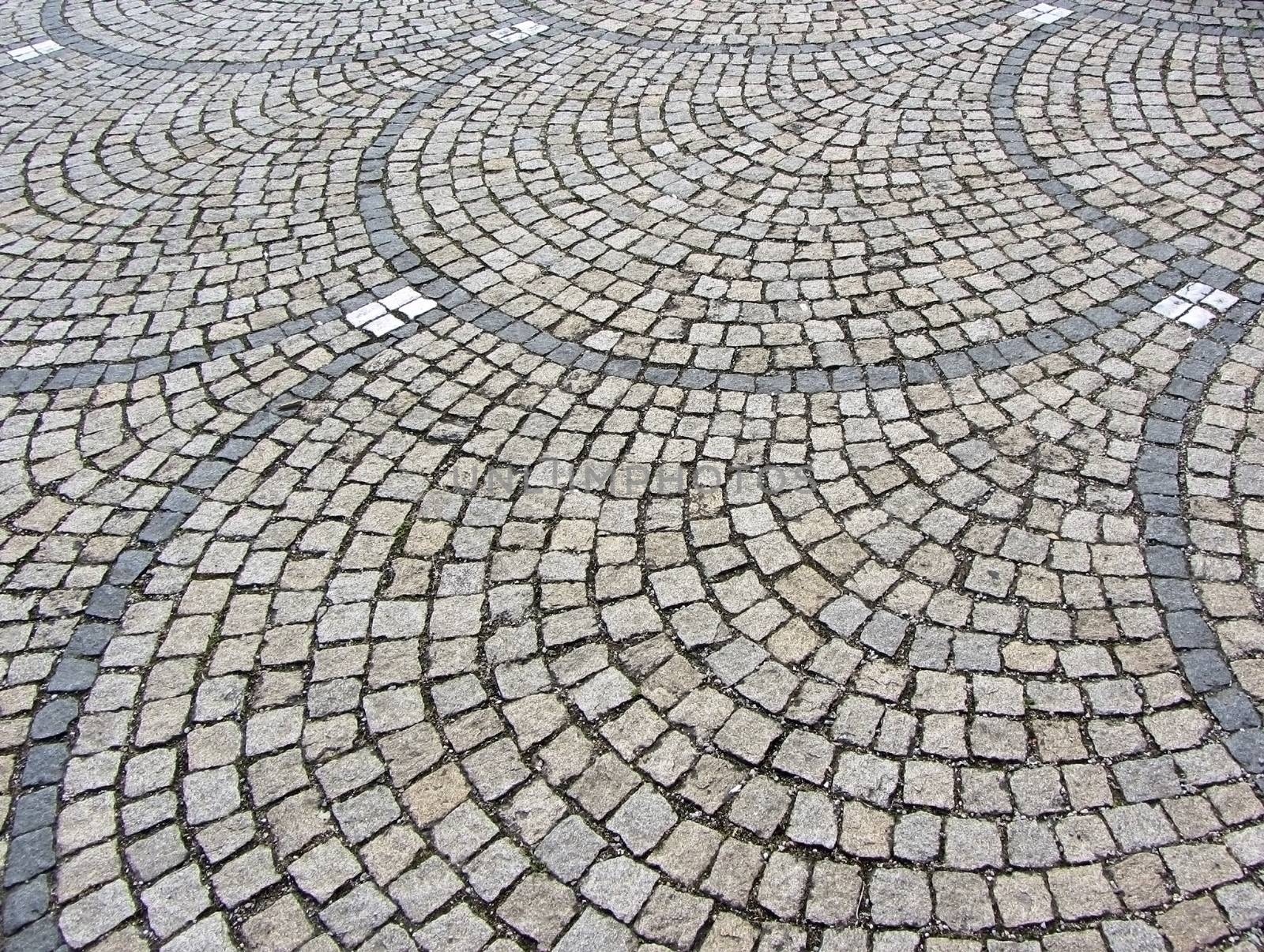 Old stone pavement in perspective. by LanaLeta