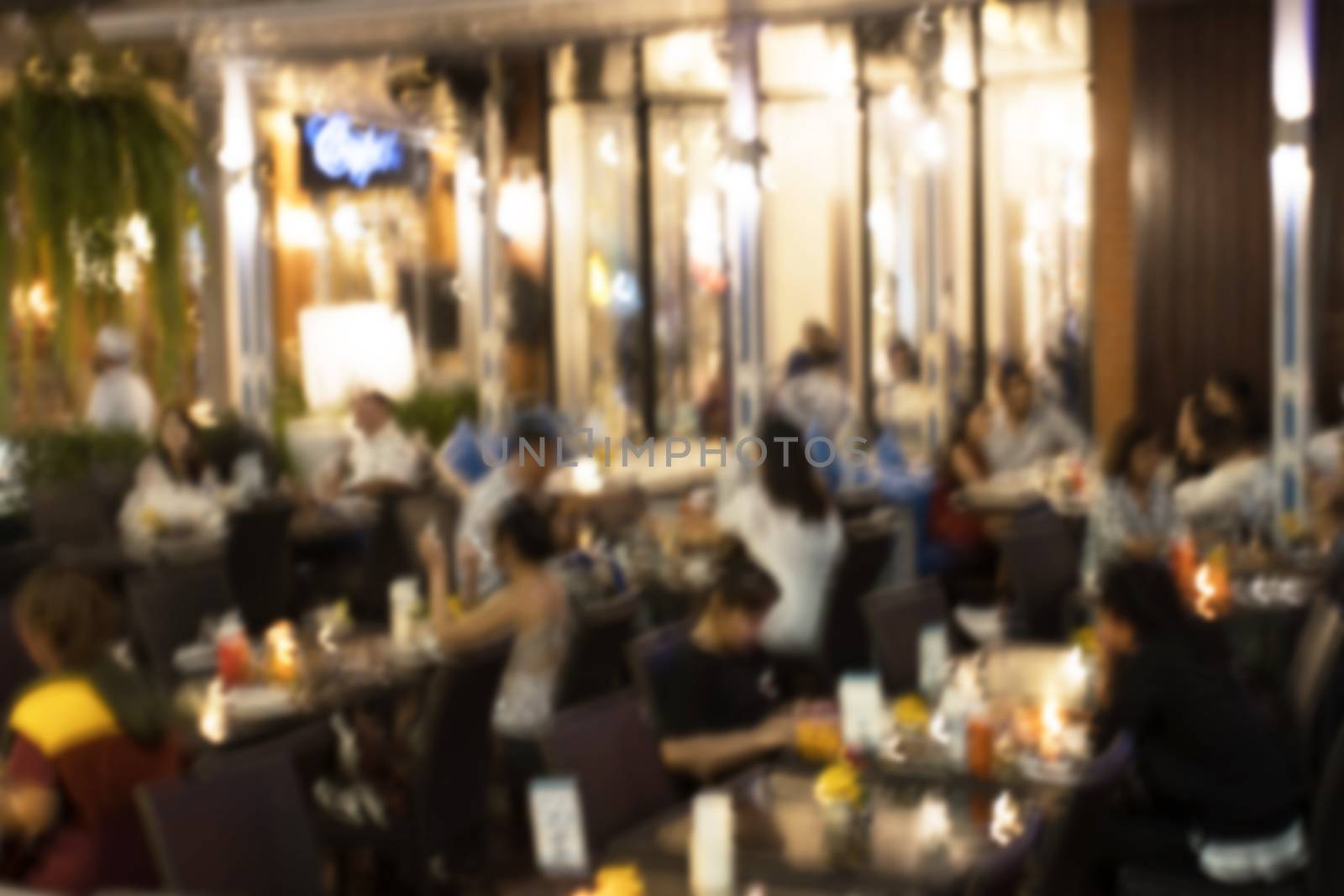 blurred image Lots of people enjoy at the bar pub fun of night festival in a restaurant and The atmosphere is party happy and relaxing.