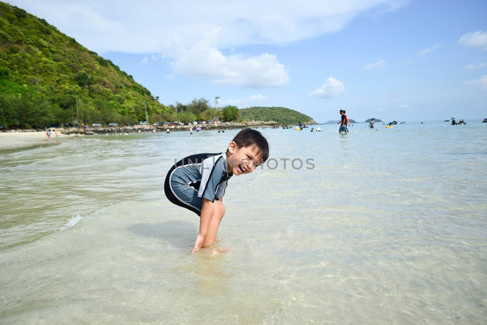 The boys are happy and fun to see the ocean for the first time. by wattanaphob