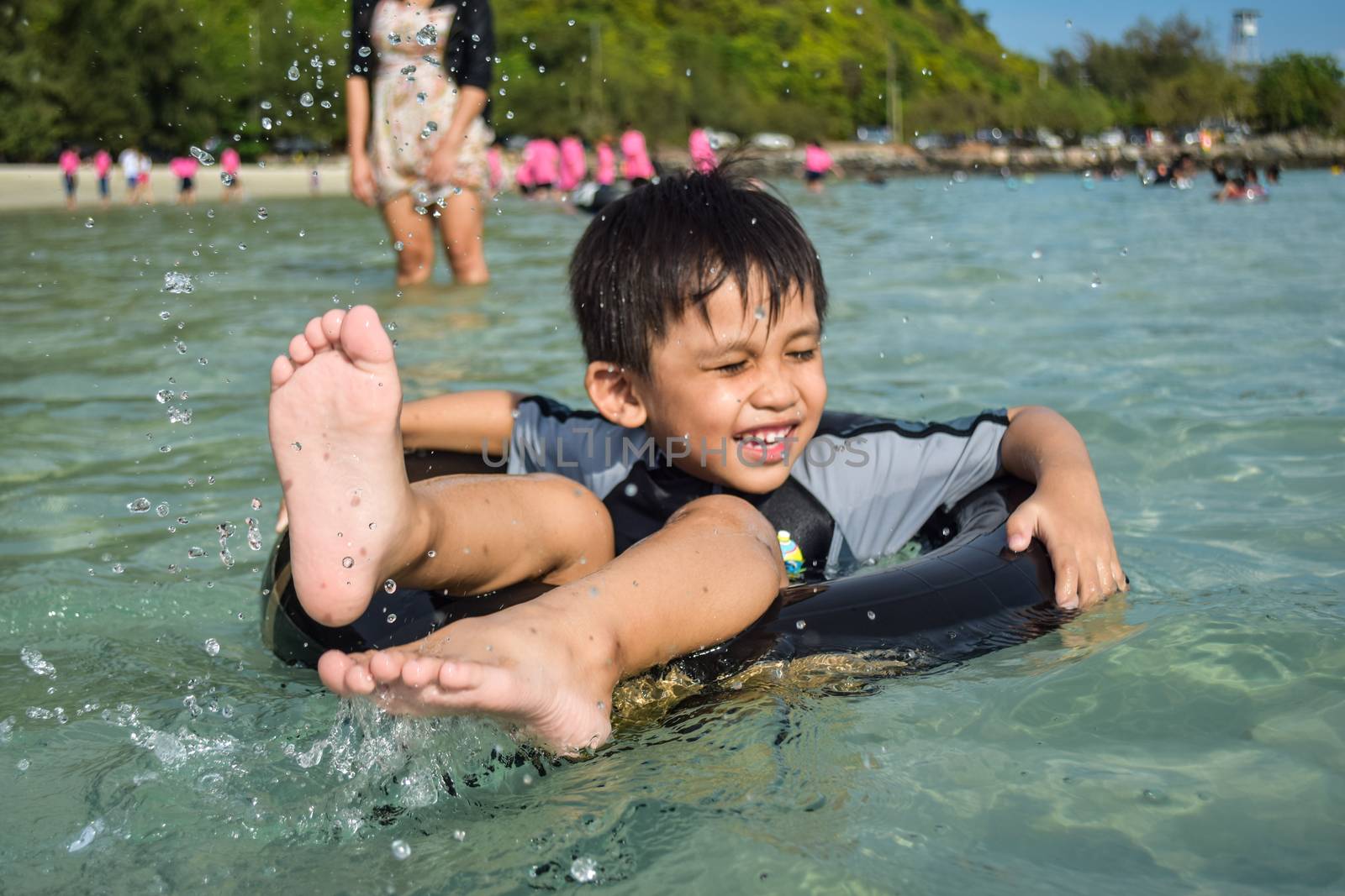 Rayong,Thailand,May5th,2014:The boys are happy and fun to see the ocean for the first time.