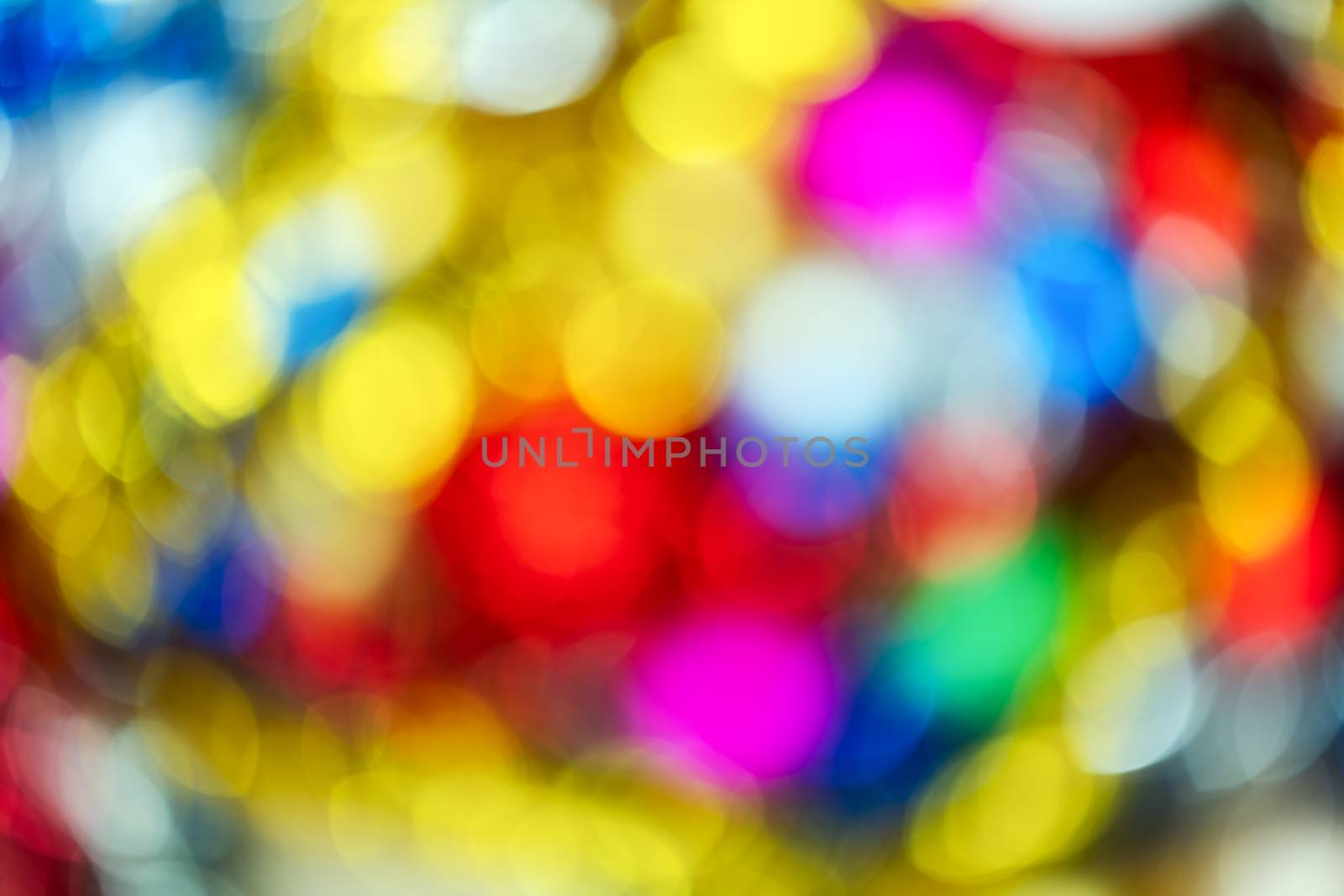 Blurred beautiful Happy New Year holiday decorations, colorful abstract bokeh background effect glowing Christmas lights by Alexander-Piragis