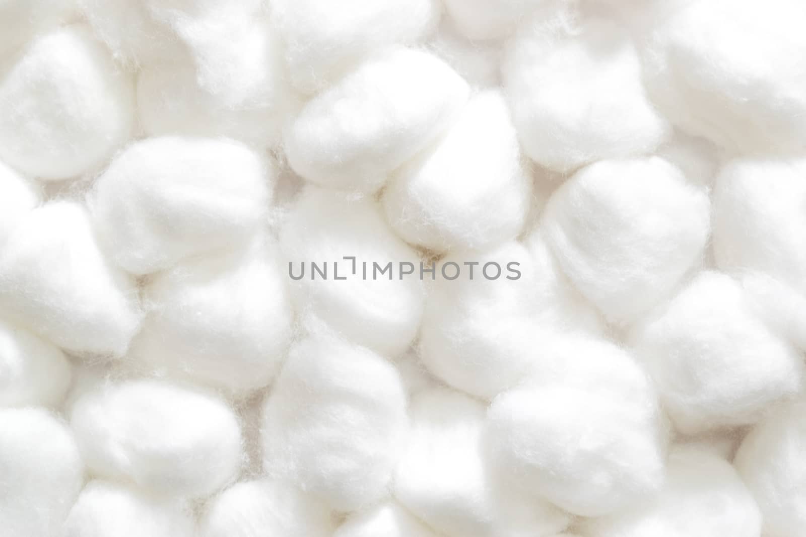 fluffy wedding of a kind originally made from raw cotton, used for cleansing wounds, removing cosmetics, and padding delicate objects.