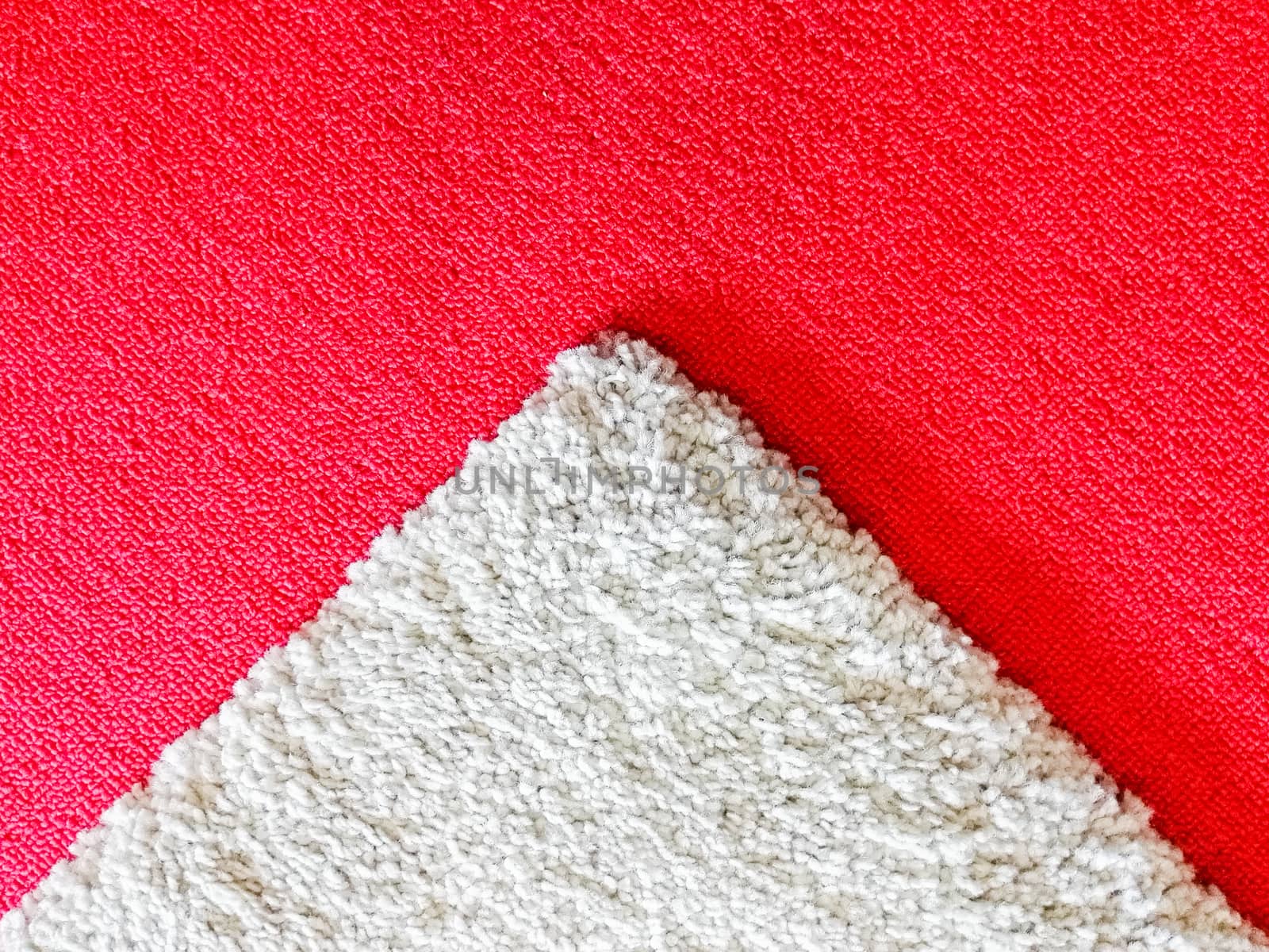 Red and white carpet in the room and office.