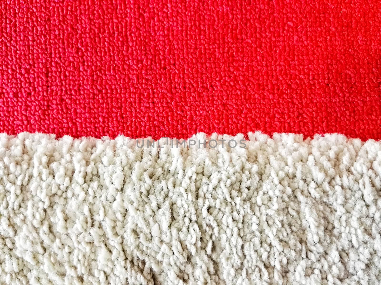 Red and white carpet in the room and office.