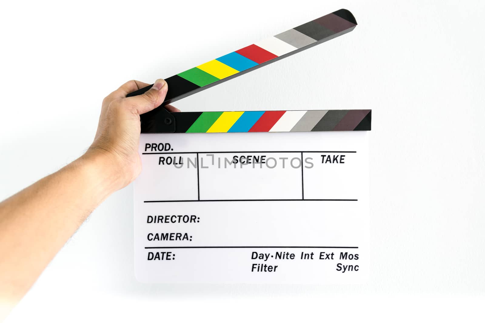 Man's hand holding a slate on hand for the filming.