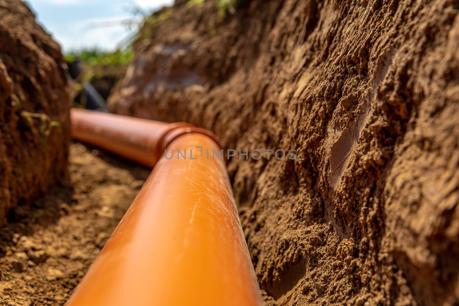 plastic pipes in the ground for wastewater and rainwater.