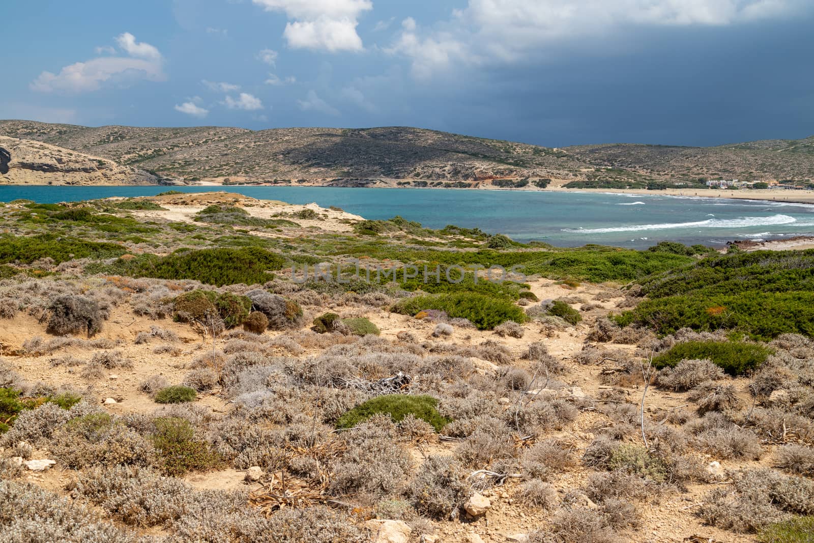 Scenic view from peninsula Prasonisi on Rhodes island, Greece with the mediterranean see and with dark sky before a thunderstorm