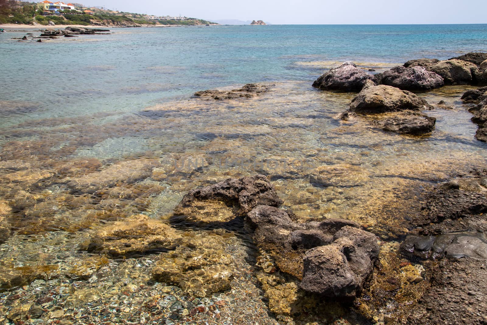 Rocky coastline at the beach of Kiotari on Rhodes island, Greece in summer at a sunny day