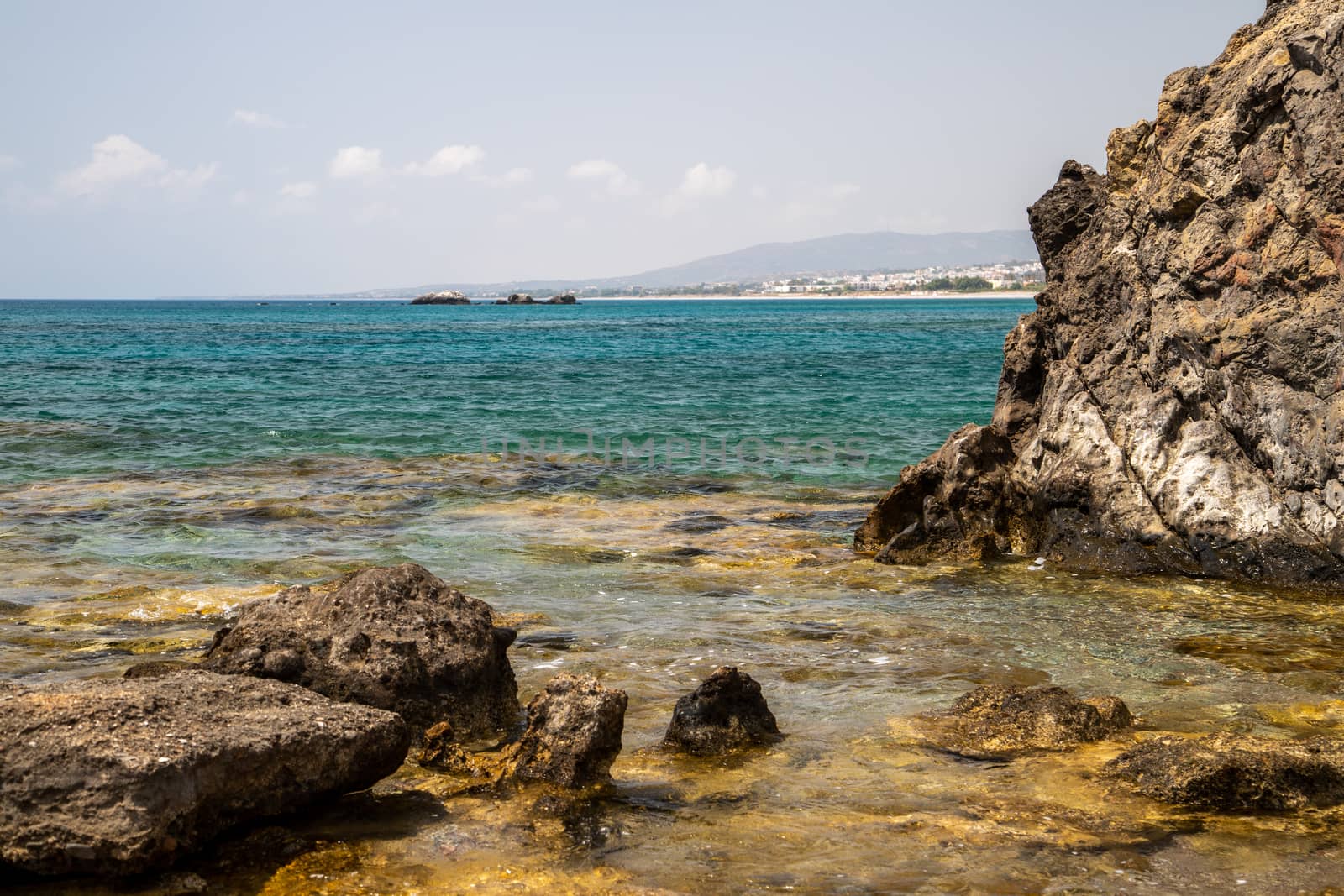 Rocky coastline at the beach of Kiotari on Rhodes island, Greece in summer at a sunny day