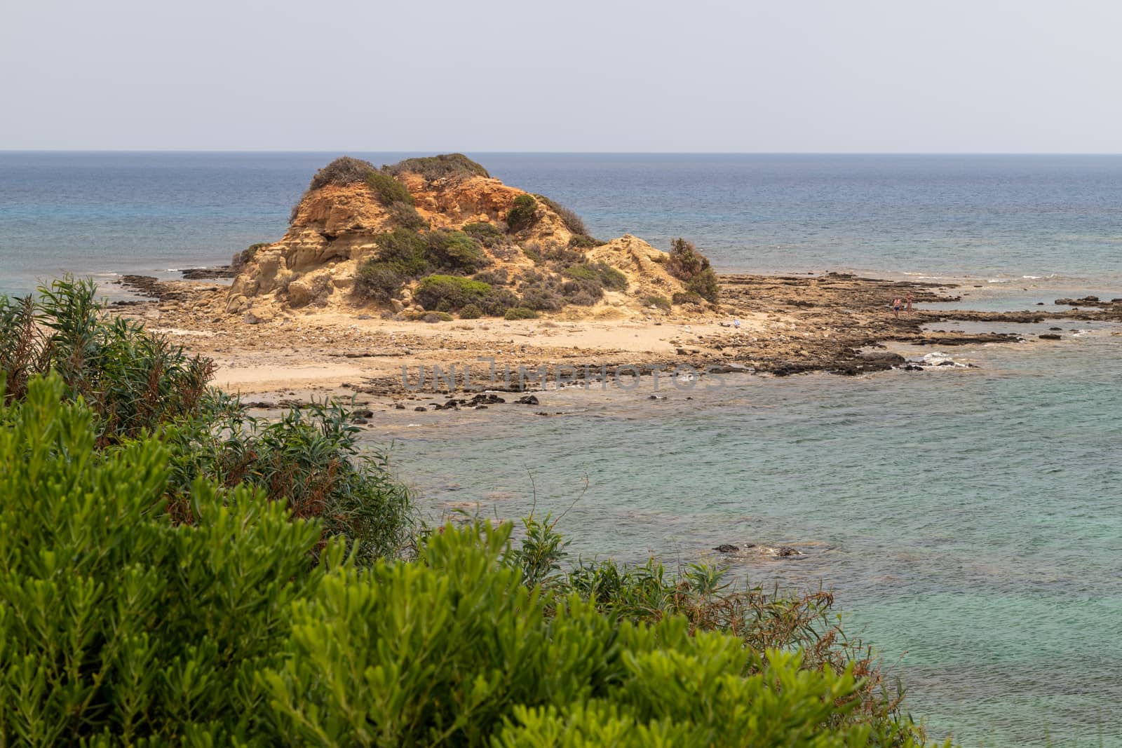 Rocky coastline at the beach of Kiotari on Rhodes island, Greece in summer at a sunny day