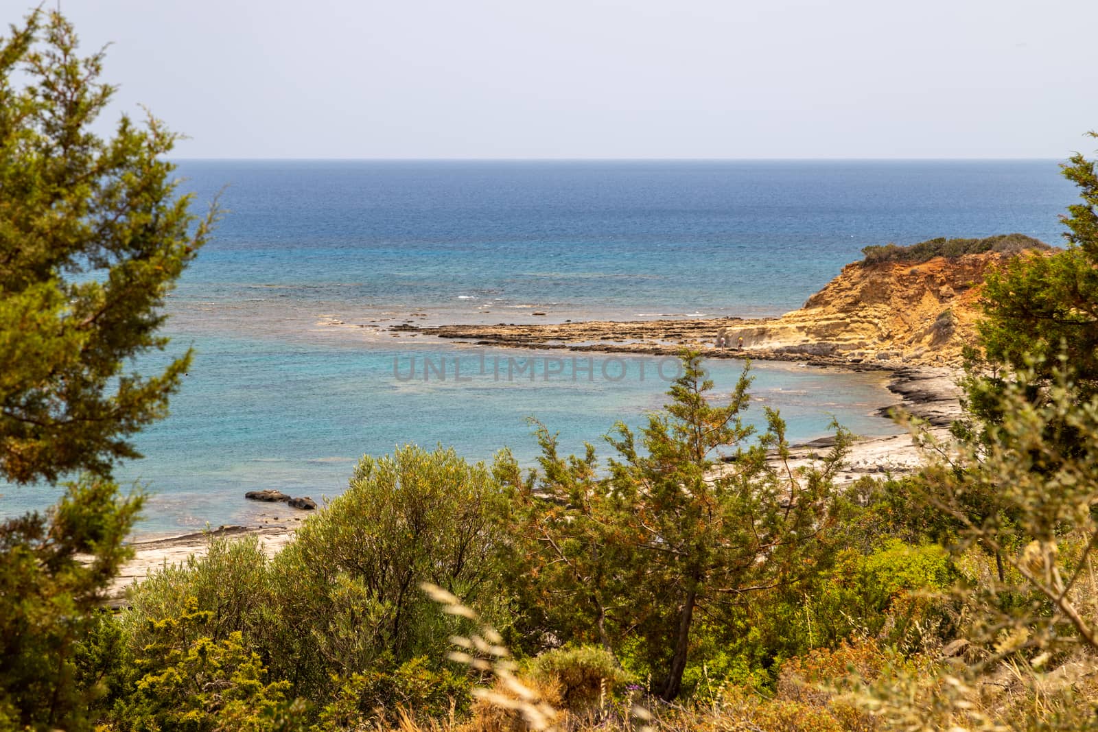 Scenic view at the coastline of Kiotari on Rhodes island, Greece with gravel beach 