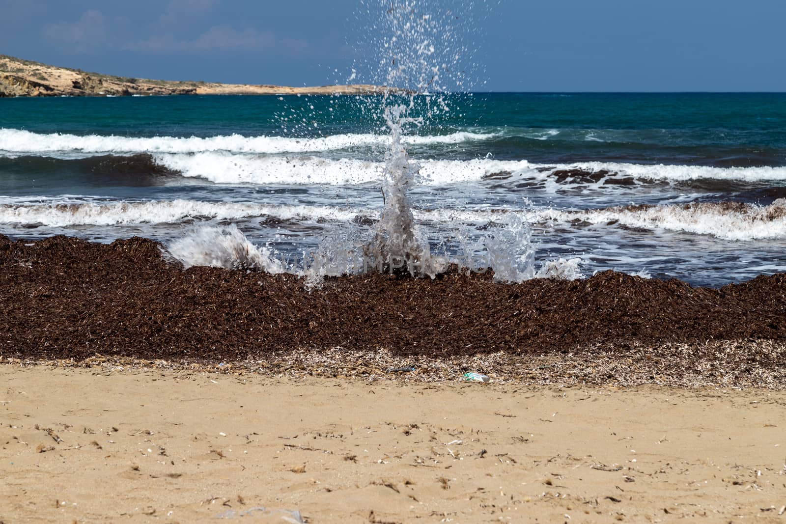 Scenic view at peninsula Prasonisi at the south side of Rhodes island, Greece with splashing water in the foreground