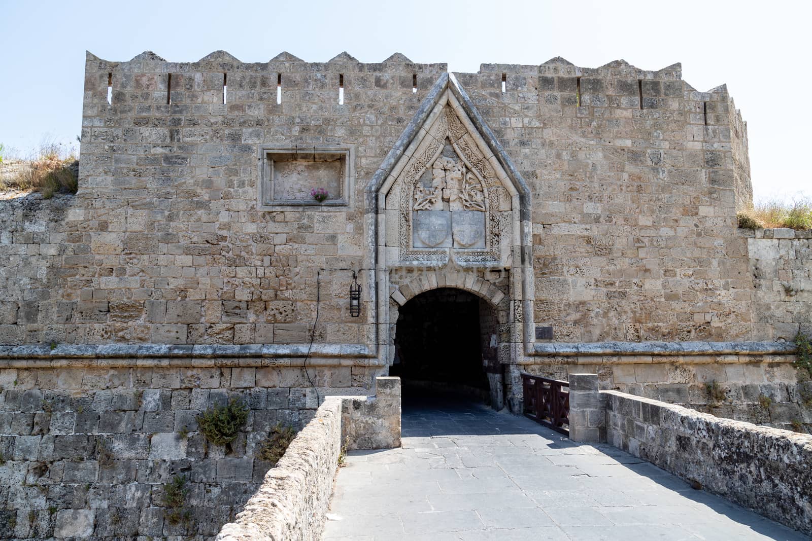 Entrance gate in the historic city wall of the old town of Rhodes city on Greek island Rhodes