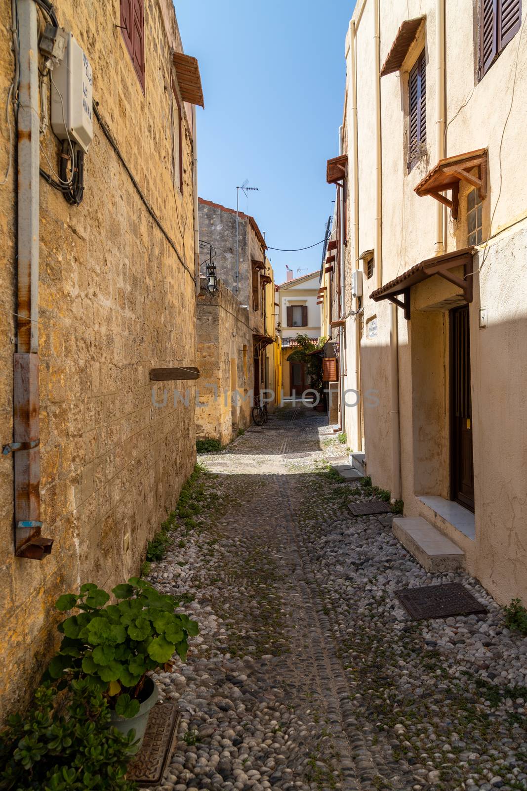 Narrow alley / lane in the old town of Rhodes city on Rhodes island, Greece