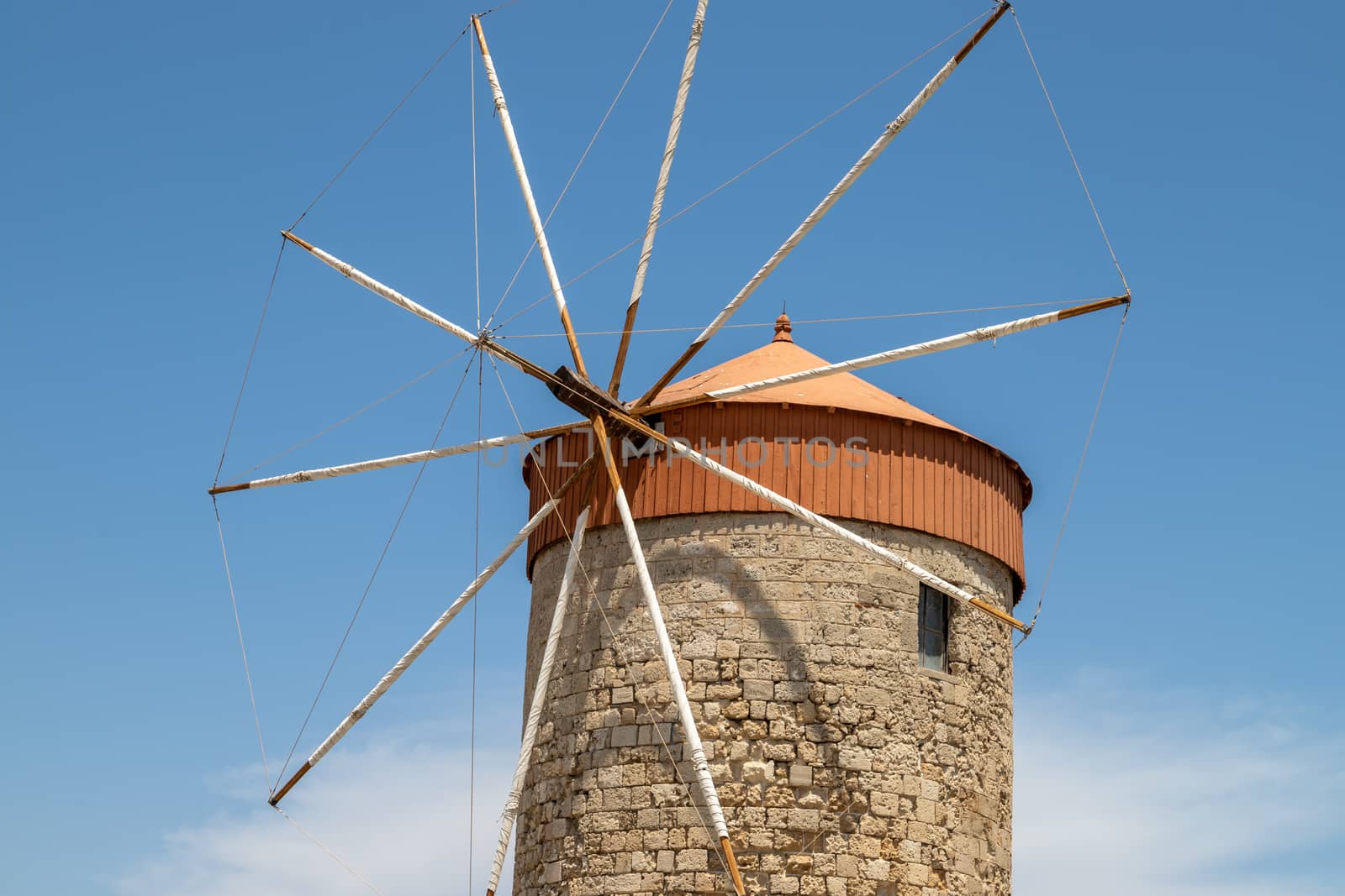 Old windmill at Mandraki  harbour in Rhodes city     by reinerc