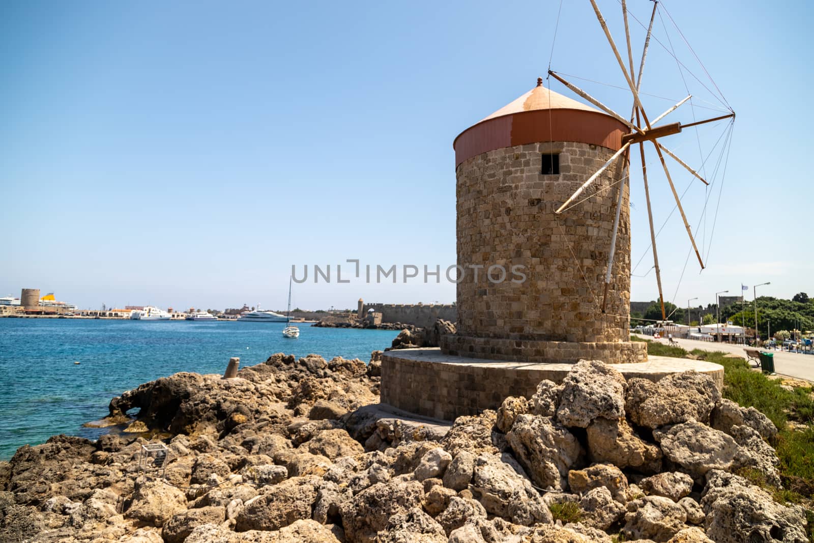 Old windmill at Mandraki  harbour in Rhodes city  on Rhodes island, greece  