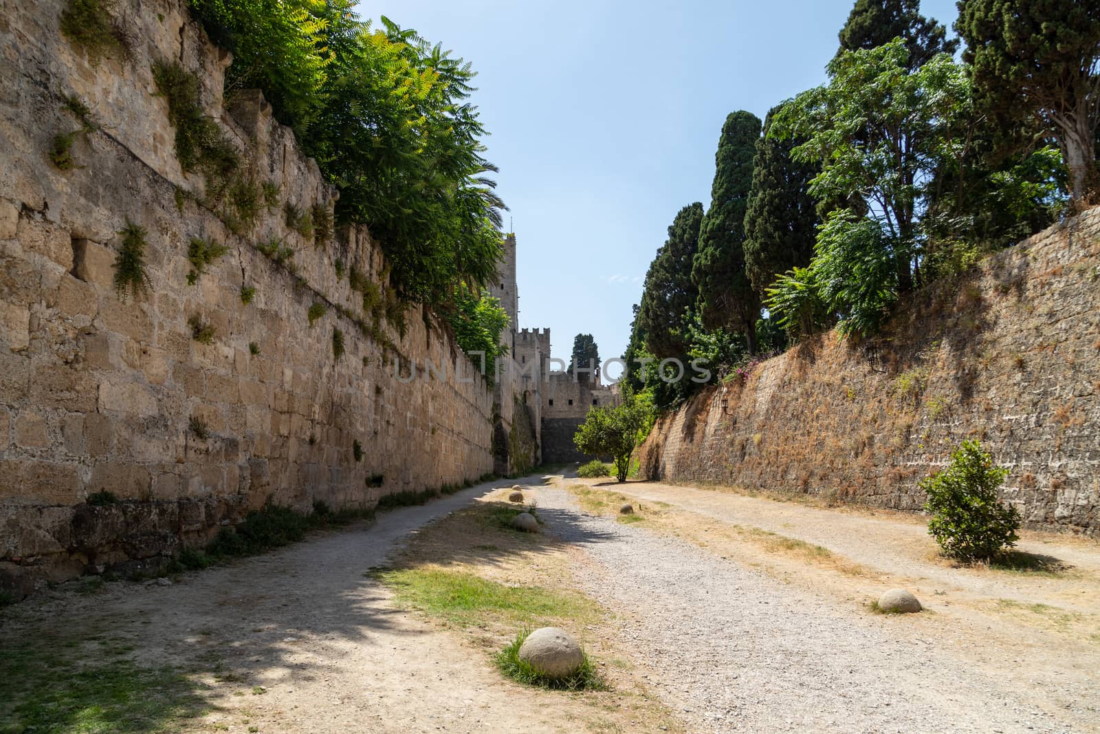 Along the ditch of the antique city wall in the old town of Rhodes city at greek island Rhodes on a sunny day in summer