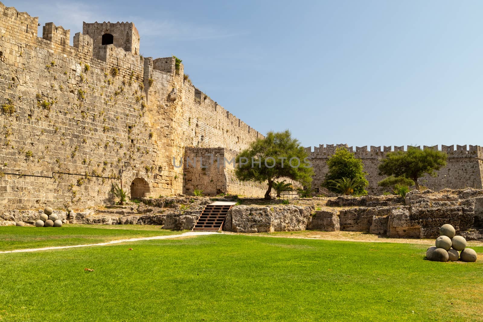 Along the ditch of the antique city wall in the old town of Rhodes city at greek island Rhodes on a sunny day in summer