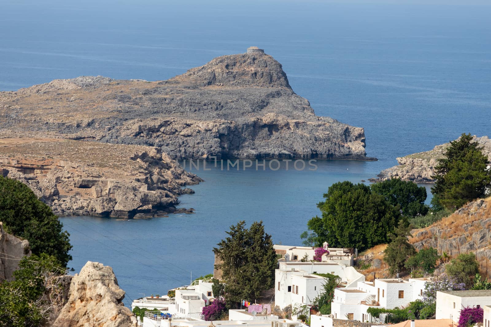 View at a bay in Lindos with white houses in the foreground, roc by reinerc