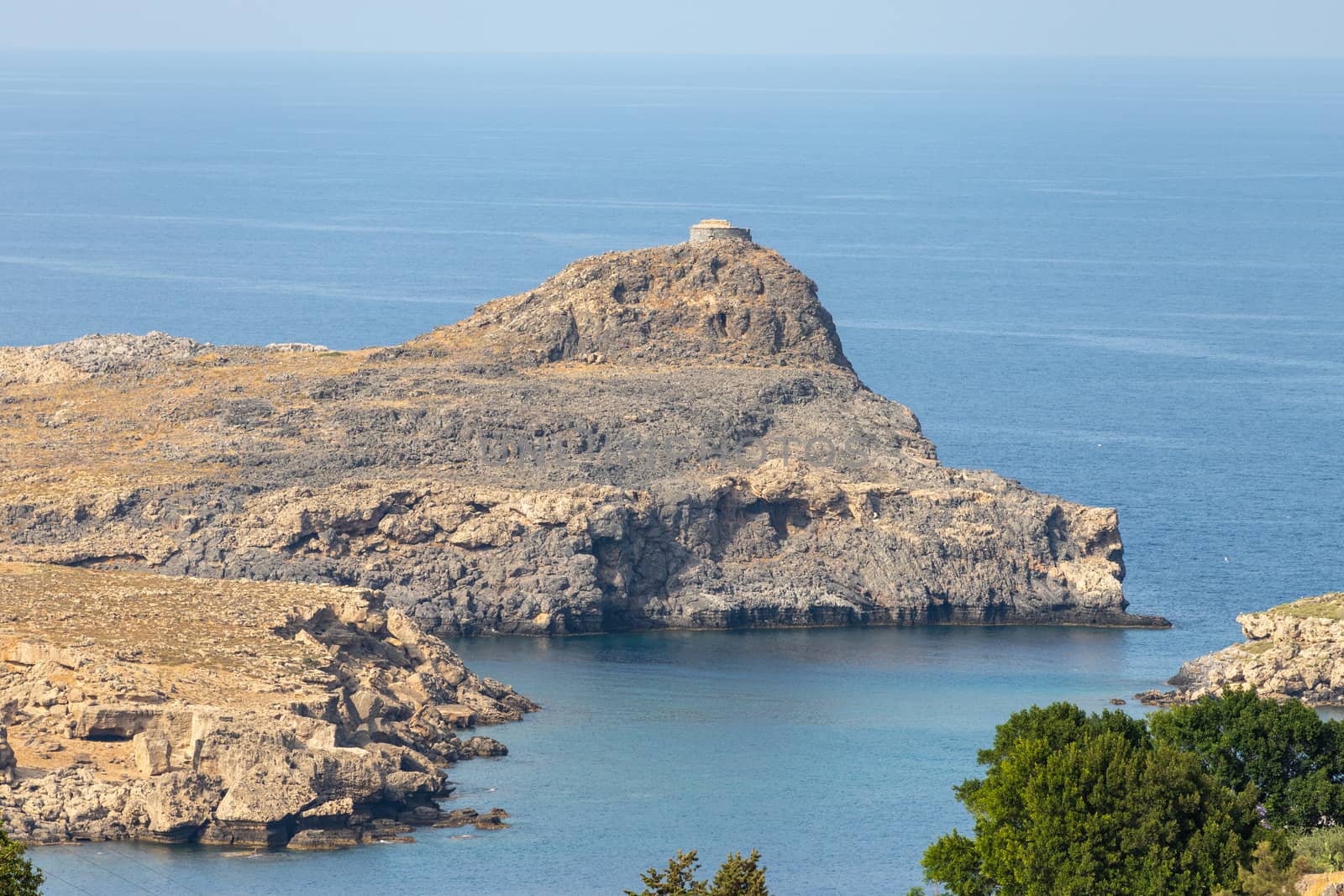 View at a bay in Lindos with rocky coastline on Greek island Rho by reinerc