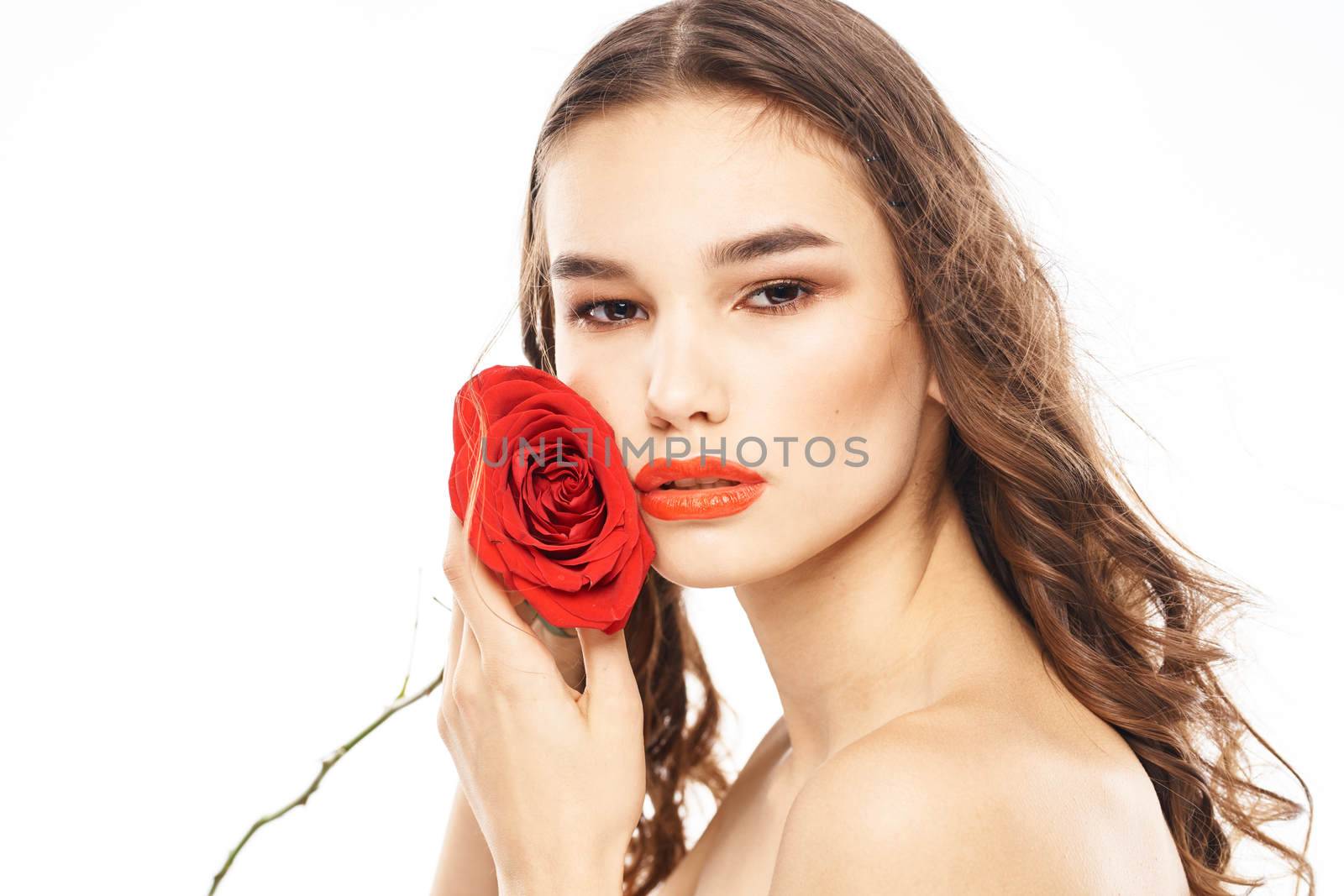 Woman with naked shoulders and red rose evening makeup light background by SHOTPRIME